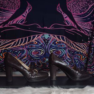 Brown Aldo all leather/wood platform heel.